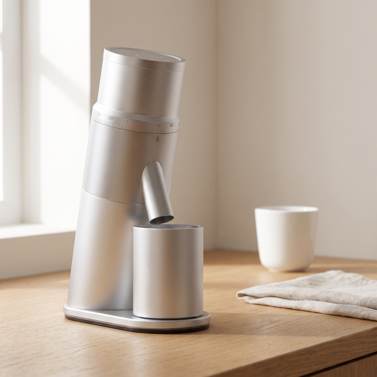 Silver CAFOVO G1048C single dose coffee grinder on a light oak kitchen counter