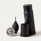 CAFOVO G1048C in black with the conical burr and air blower supplied in the box