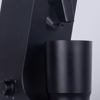 Close-up of the chute, dosing cup and control knob of the CAFOVO G255CV grinder