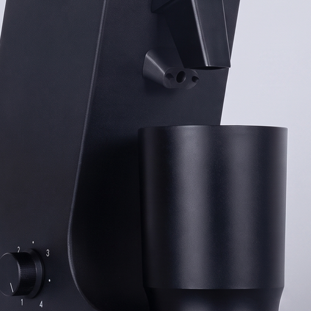 Close-up of the chute, dosing cup and control knob of the CAFOVO G255CV grinder