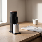 CF Wisdom portable coffee grinder on an oak kitchen counter in morning light