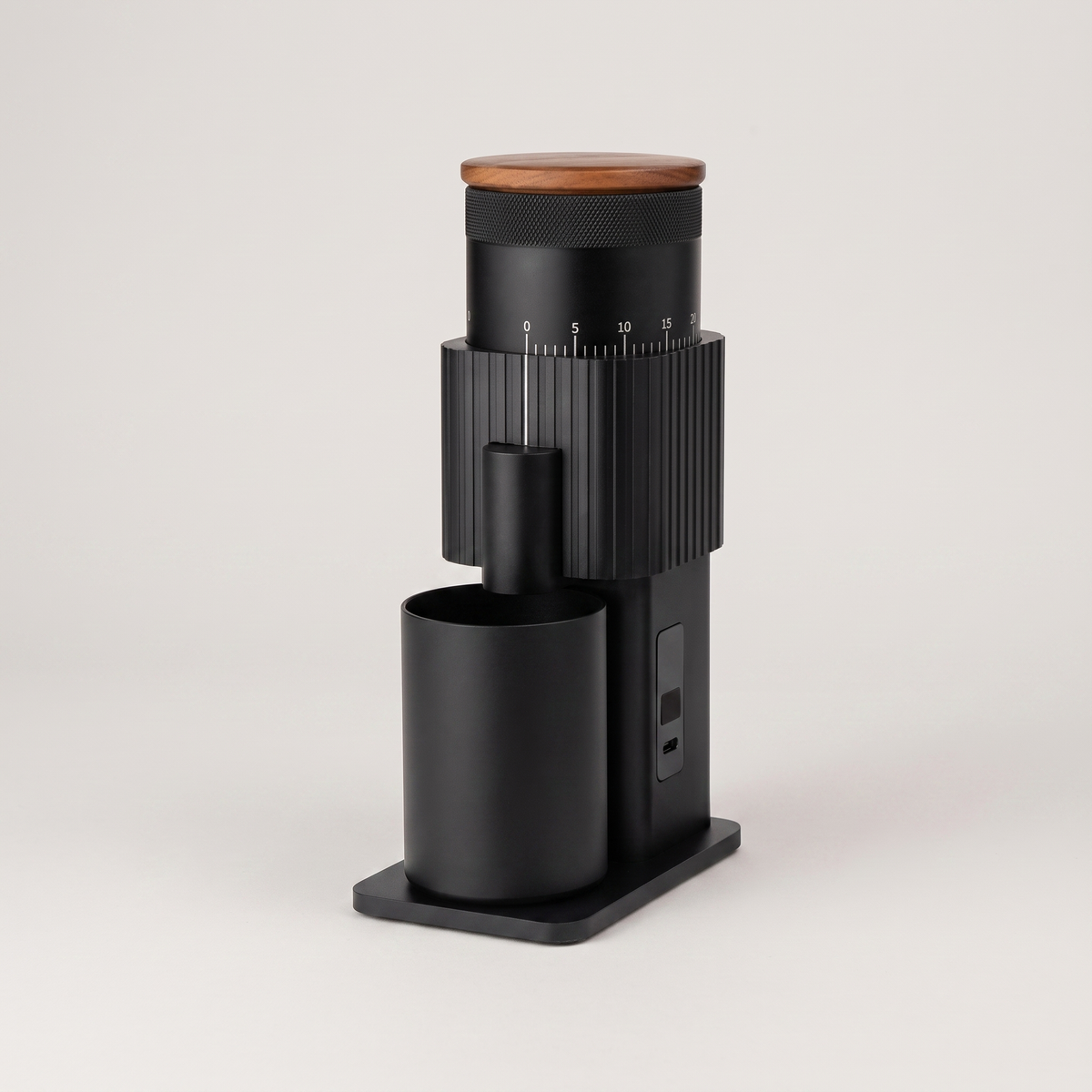 Black CF Wisdom portable grinder with walnut lid, three-quarter view
