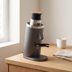 Grey DF54 flat burr espresso grinder on a light oak kitchen counter