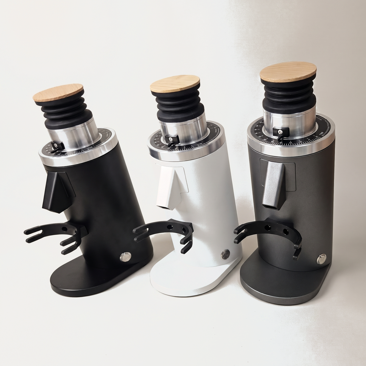 DF54 espresso grinder in black, white and dark grey side by side
