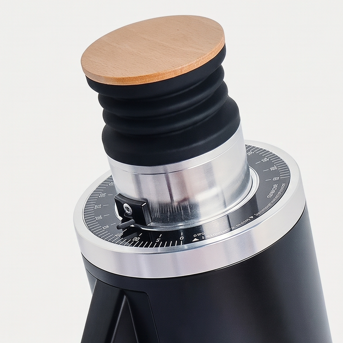 Close-up of the bamboo lid and graduated ring of the black DF54 grinder