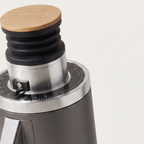 Close-up of the bamboo lid and graduated ring of the grey DF54 grinder