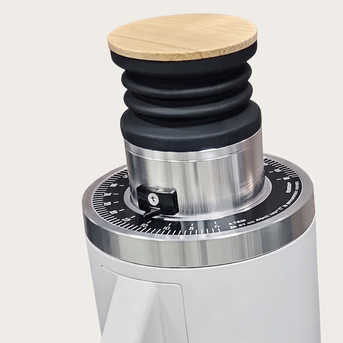Close-up of the bamboo lid and graduated ring of the white DF54 grinder