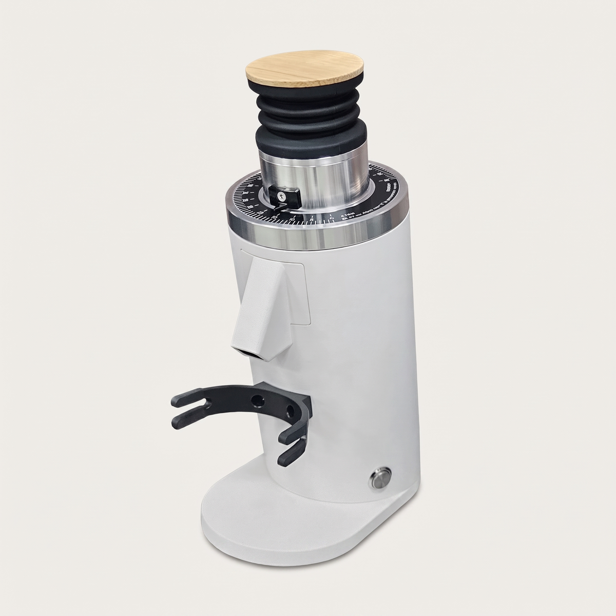 DF54 coffee grinder in white, three-quarter view with the portafilter fork