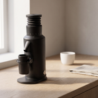 GZZT GF64 espresso grinder on an oak kitchen counter in morning light