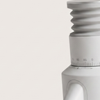 Close-up of the ribbed collar and graduated ring of the white GZZT GF64 grinder