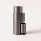 Graphite grey SIMELO Alien grinder seen from the vented side