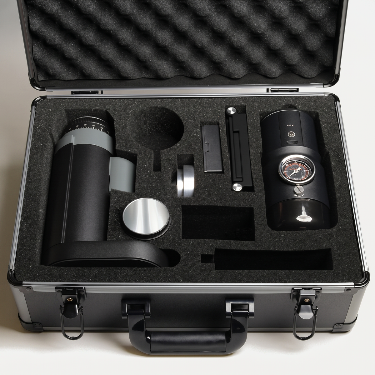 STARSEEKER Go50 travel case open, showing the grinder and accessories in the foam insert